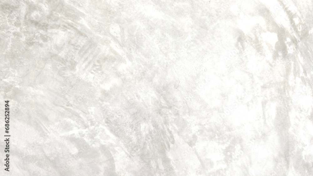 The light-colored cement wall has cracks. The light-colored cement wall has cracks.