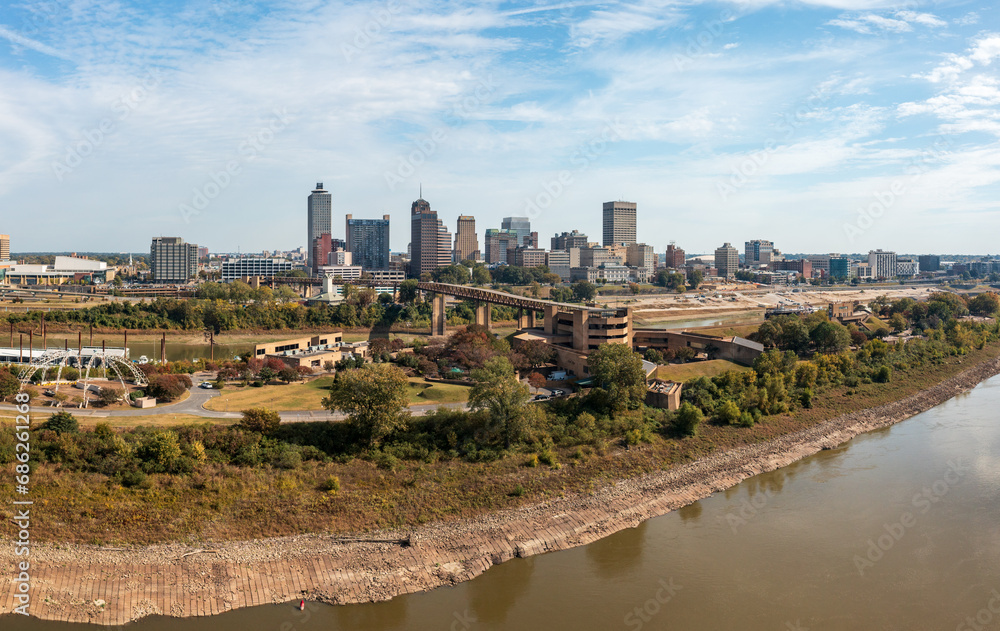 Fototapeta premium Panoramic view of Memphis Tennessee cityscape with low water levels in the Mississippi river and Wolf River Harbor