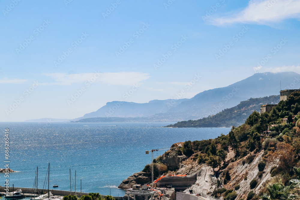Ventimiglia, Italy -  July 30, 2023 : View of the seaside promenade in the town of Ventimiglia, Italy