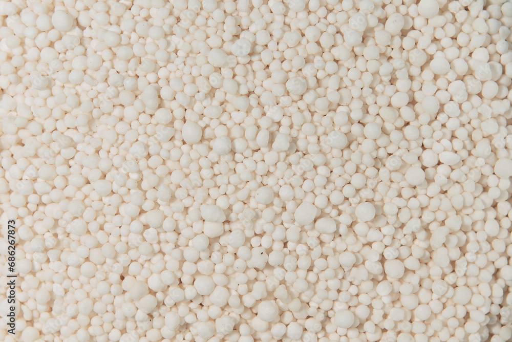 Granulated mineral fertilizers on a dark background Granulated mineral fertilizers on a dark background