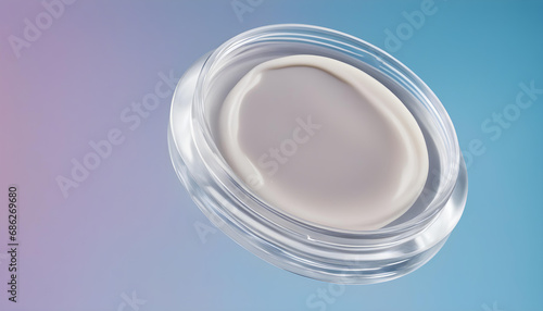 banner smear of cream round transparent drop of banner transparent gel serum in a petri dish on a blue background