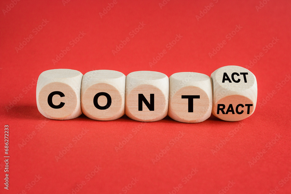 From contact to contract symbol. Turned a wooden cube and changed the word contact to contract. Beautiful red background, copy space. Business, from contact to contract concept. From contact to contract symbol. Turned a wooden cube and changed the word contact to contract. Beautiful red background, copy space. Business, from contact to contract concept.