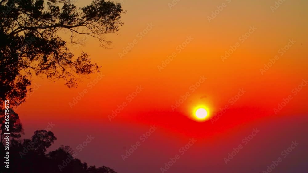 Amazing yellow sun in red sky at sunrise above the horizon..beautiful sunrise on the high mountain in camping park..Amazing bright red sky at sunrise. Sky texture, abstract nature background. Amazing yellow sun in red sky at sunrise above the horizon..beautiful sunrise on the high mountain in camping park..Amazing bright red sky at sunrise. Sky texture, abstract nature background.