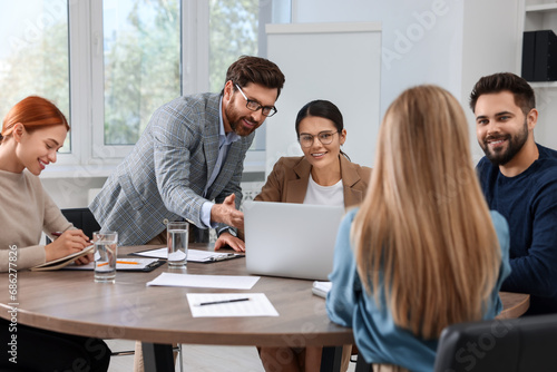 Team of employees working together in office