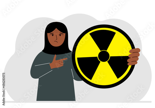 A woman holds in his hand a large sign warning about radiation danger. Vector