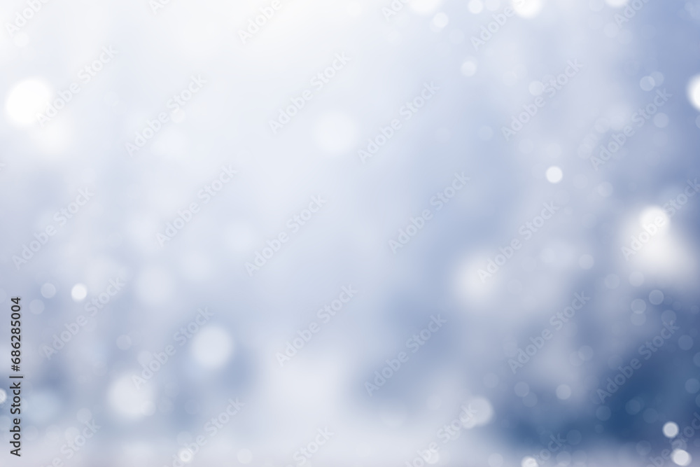 blue defocus winter background with falling snow