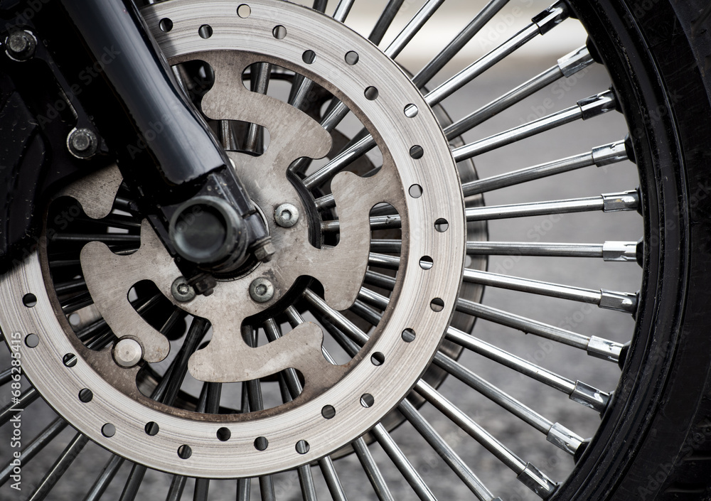 Motorbike front wheel close-up, outdoor on street. bike riding. Close up front wheel of a motorcycle. Motorbike front wheel close-up, outdoor on street. bike riding. Close up front wheel of a motorcycle.