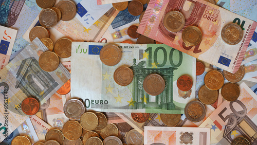 euro note and coins background (ID: 686287489)