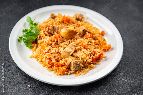 rice with meat tasty pilaf with fresh pork meat healthy eating cooking appetizer meal food snack on the table copy space