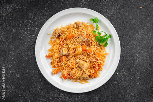 rice with meat tasty pilaf with fresh pork meat healthy eating cooking appetizer meal food snack on the table copy space