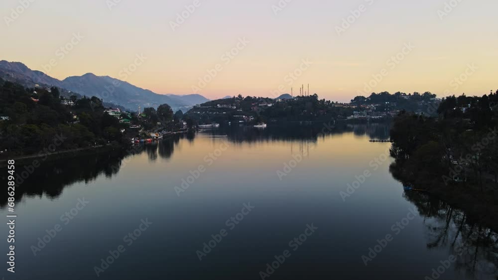 Aerial view of Bhimtal lake in Nainital, Uttarakhand. Drone view of a beautiful lake situated amidst hills of Himalayas. Sunset view of a Bhimtal lake in Kumaon, India. Lake views in the mountains. Aerial view of Bhimtal lake in Nainital, Uttarakhand. Drone view of a beautiful lake situated amidst hills of Himalayas. Sunset view of a Bhimtal lake in Kumaon, India. Lake views in the mountains.