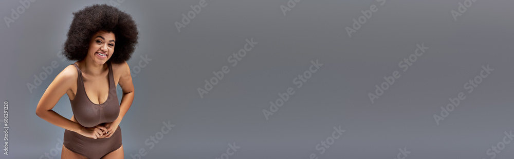 cheerful african american female model in pastel underwear smiling happily, fashion concept, banner cheerful african american female model in pastel underwear smiling happily, fashion concept, banner