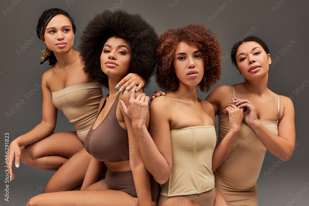 attractive young african american women in pastel underwear looking at camera, fashion concept attractive young african american women in pastel underwear looking at camera, fashion concept