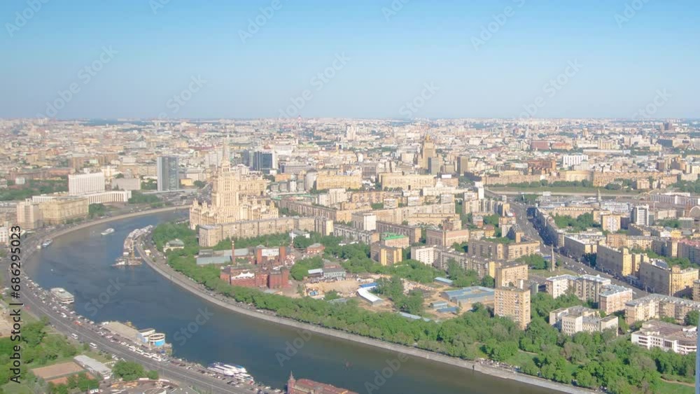 Panoramic aerial view from Skyscrapers of Moscow City business complex timelapse from top. View from above to river and waterfront trought modern towers Panoramic aerial view from Skyscrapers of Moscow City business complex timelapse from top. View from above to river and waterfront trought modern towers