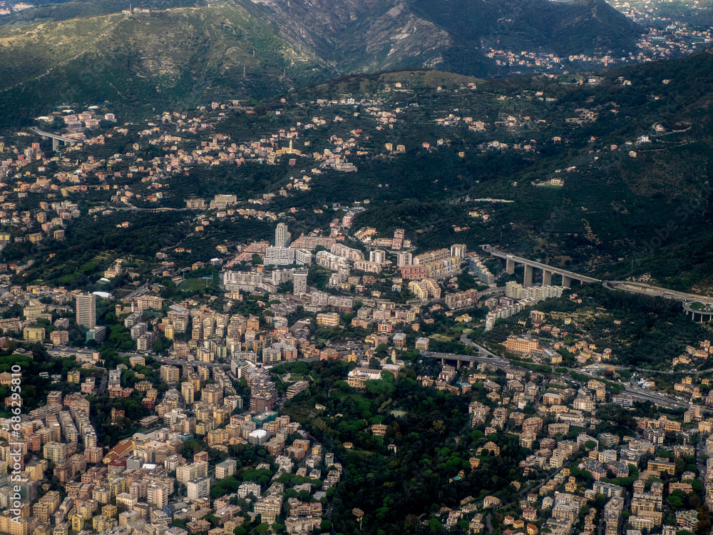 Genoa aerial view before landing to airport by airplane during a sea storm tempest hurricane