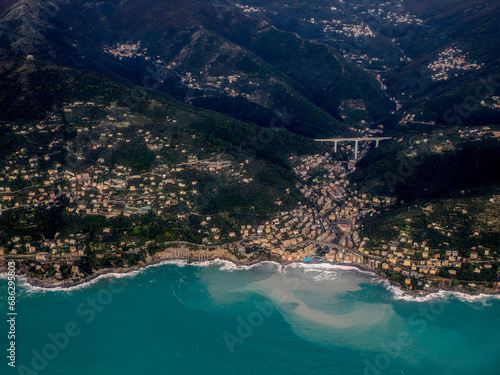 Bogliasco Genoa aerial view before landing to airport by airplane during a sea storm tempest hurricane