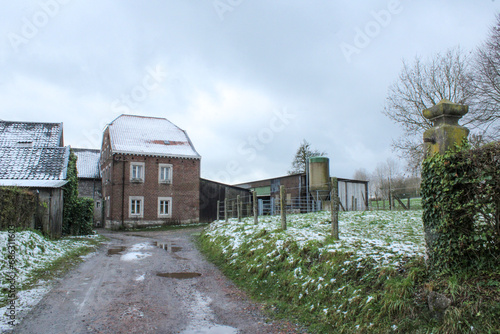 Old brick farm in Pays de Herve under the snow