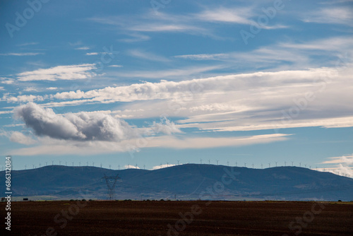 windmills producing electricity on the ridge of a mountain in the Campos de Castilla