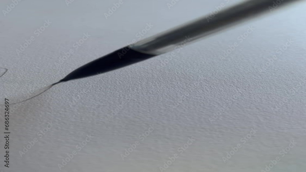 Mechanical pencil drawing a squiggly line on white paper Mechanical pencil drawing a squiggly line on white paper