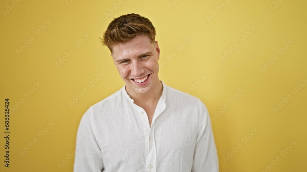 Laughing, confident young caucasian man in casual fashion, standing isolated against a yellow background, radiating positive vibes and joy Laughing, confident young caucasian man in casual fashion, standing isolated against a yellow background, radiating positive vibes and joy