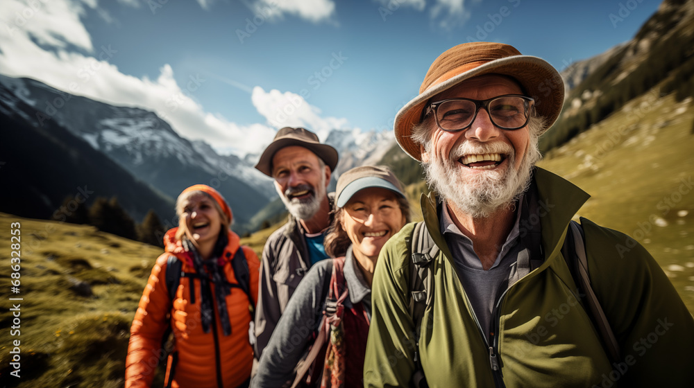 A happy group of elderly people walking on mountain trail in a sunny day. A happy group of elderly people walking on mountain trail in a sunny day.