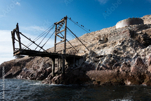 Old bridge over the sea. Paracas, Peru.