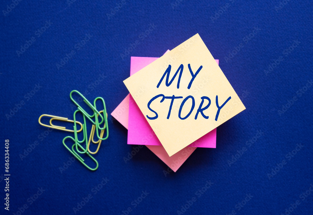 My story symbol. Orange steaky note with words My story. Beautiful deep blue background. Business and My story concept. Copy space.