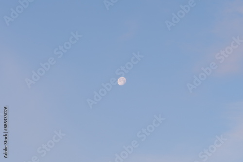 the moon in the sky during the day