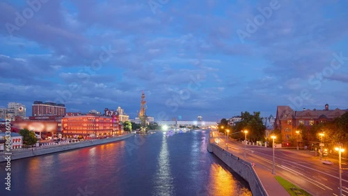 View from the Patriarch bridge to the river panorama of Moscow day to night transition aerial timelapse. Traffic on the road near waterfront