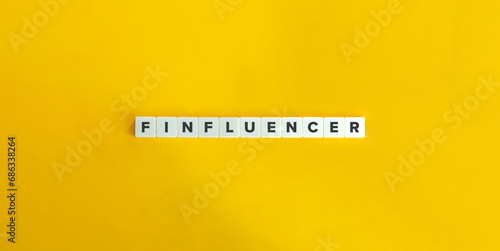 Finfluencer, Financial Influencer. The Future of Finance Marketing. Word on Block Letter Tiles on Yellow Background. Minimalist Aesthetics.