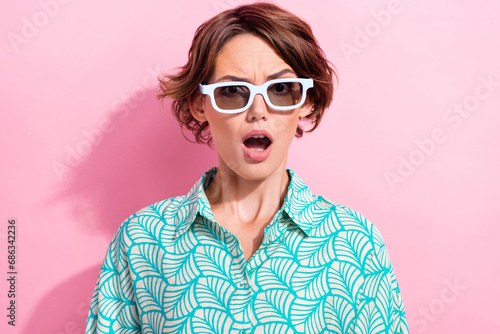 Photo of speechless impressed girl open mouth staring wear 3d glasses isolated on pink color background