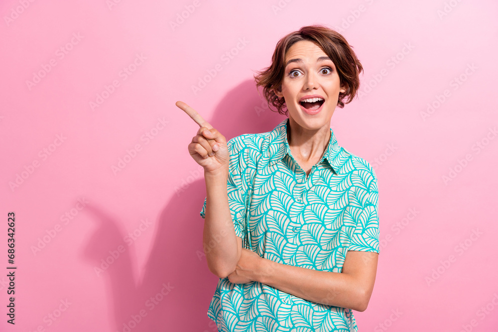 Photo of funny lady showing cool novelty offer proposition mockup blank space wear printed shirt isolated pink color background