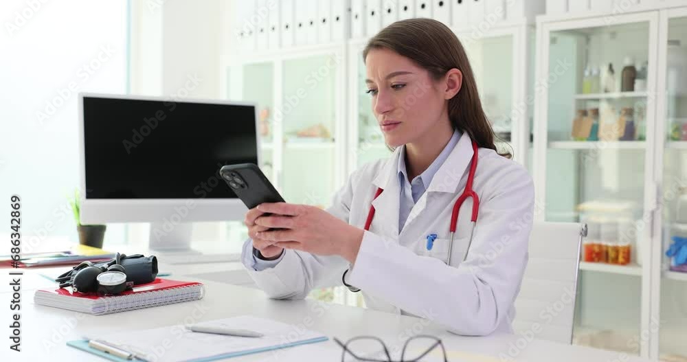Doctor uses mobile phone and gives virtual online consultations Doctor uses mobile phone and gives virtual online consultations