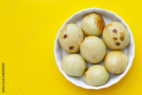 Djenkol fruit bean on yellow background