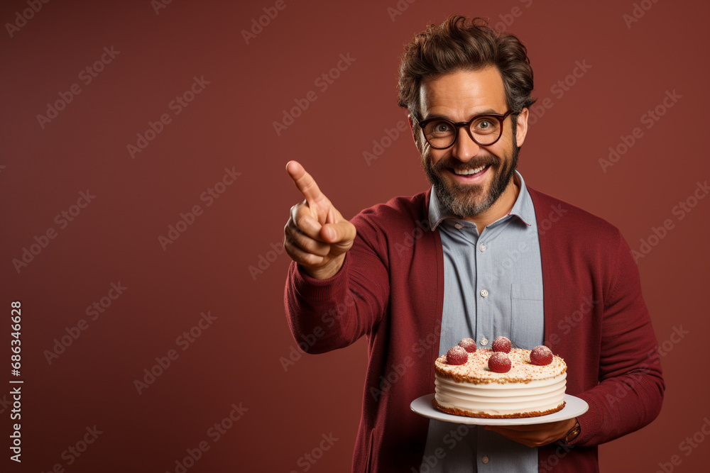 custom made wallpaper toronto digitalFunny man offering a cake in a suit on a red background, instead of a gift, February 14, points with a finger