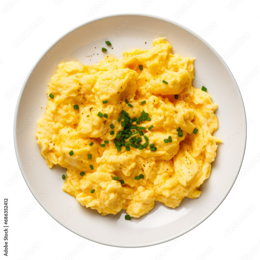 Creamy scrambled eggs garnished with chives on a white dish. Creamy scrambled eggs garnished with chives on a white dish.