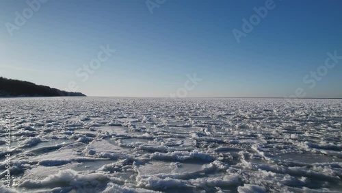 North nature ice landscape with a lot of ice floes. Drone aerial top view of Gulf of Finland. Baltic sea in winter