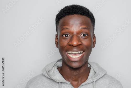 Happy cheerful young African gen Z isolated on white background. Funny smile teen student