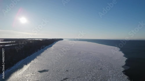 North nature landscape with a lot of ice floes. Aerial top view of coast line in winter. Gulf of Finland. Baltic 