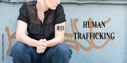 Woman with ISBN and Human Trafficking Words photo
