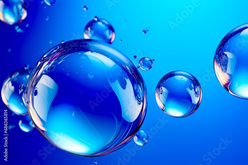 Group of bubbles floating on top of blue water filled with bubbles.