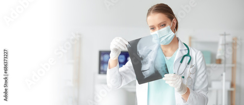 Female doctor studying x-ra...