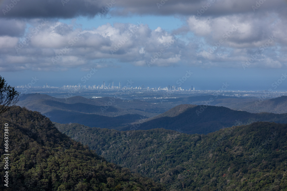 Gold Coast city, an extremely popular tourist destination, as seen from Springbrook in Lamington National Park in Queensland, Australia on a cloudy day.