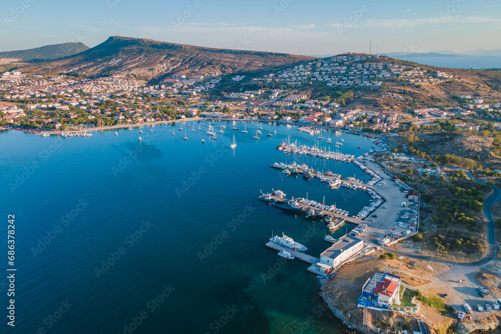 Lagoon marina with boats and yachts in Foca resort town in Turkey on Aegean sea coast. Aerial view