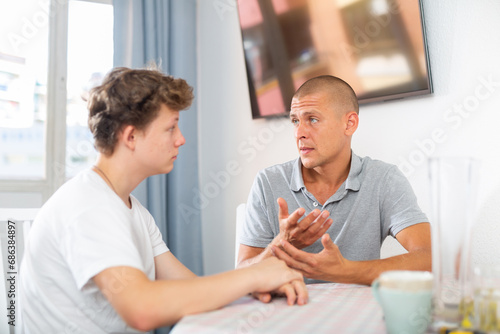 Portrait of guy with his father who are resting together at the home