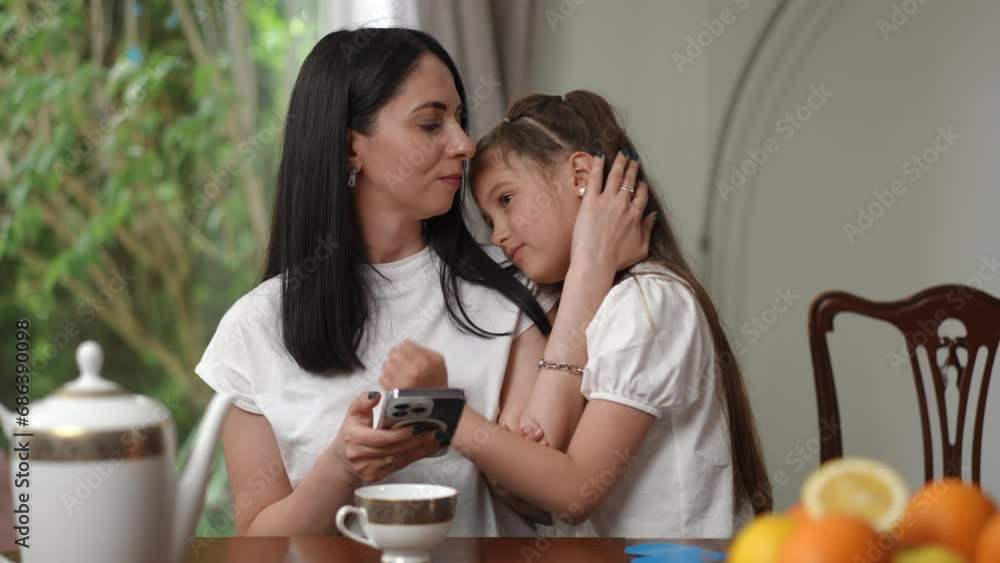 Mom and daughter spend their leisure time together. Tender moments of love Mom and daughter spend their leisure time together. Tender moments of love