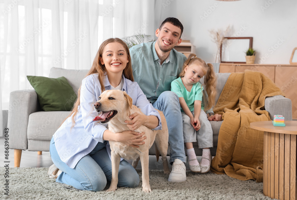Happy family with cute Labrador dog at home Happy family with cute Labrador dog at home