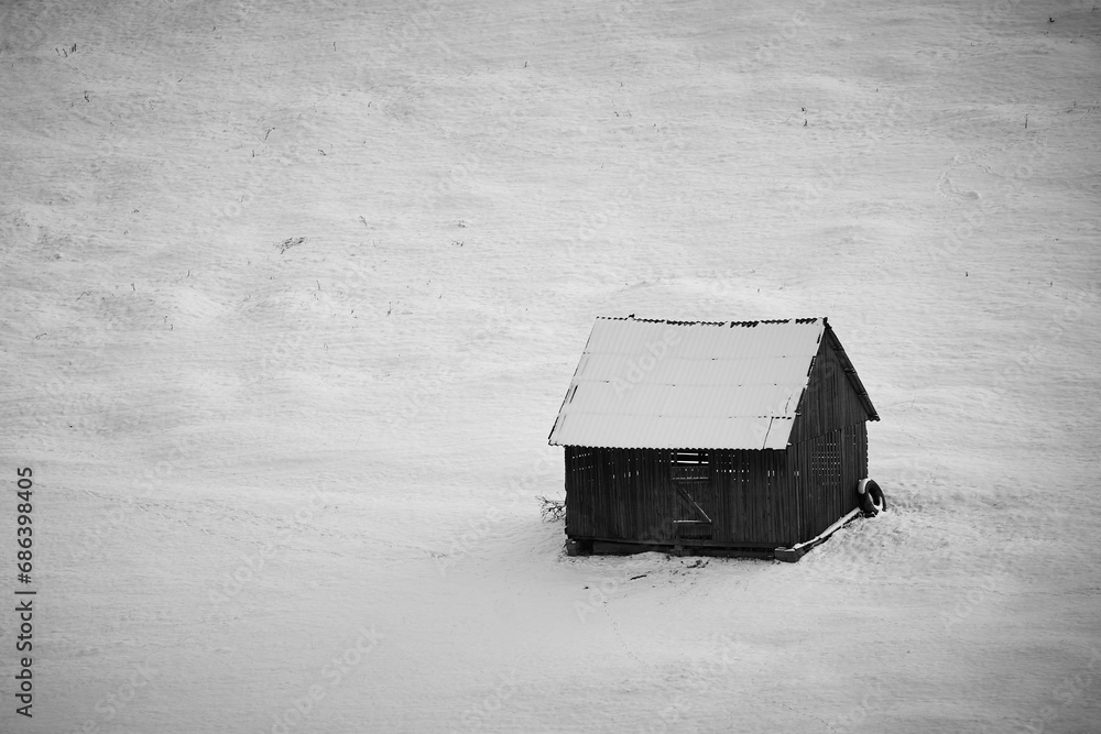 the house covered with snow on the hill