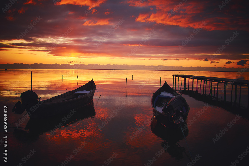boat at sunrise on the lake