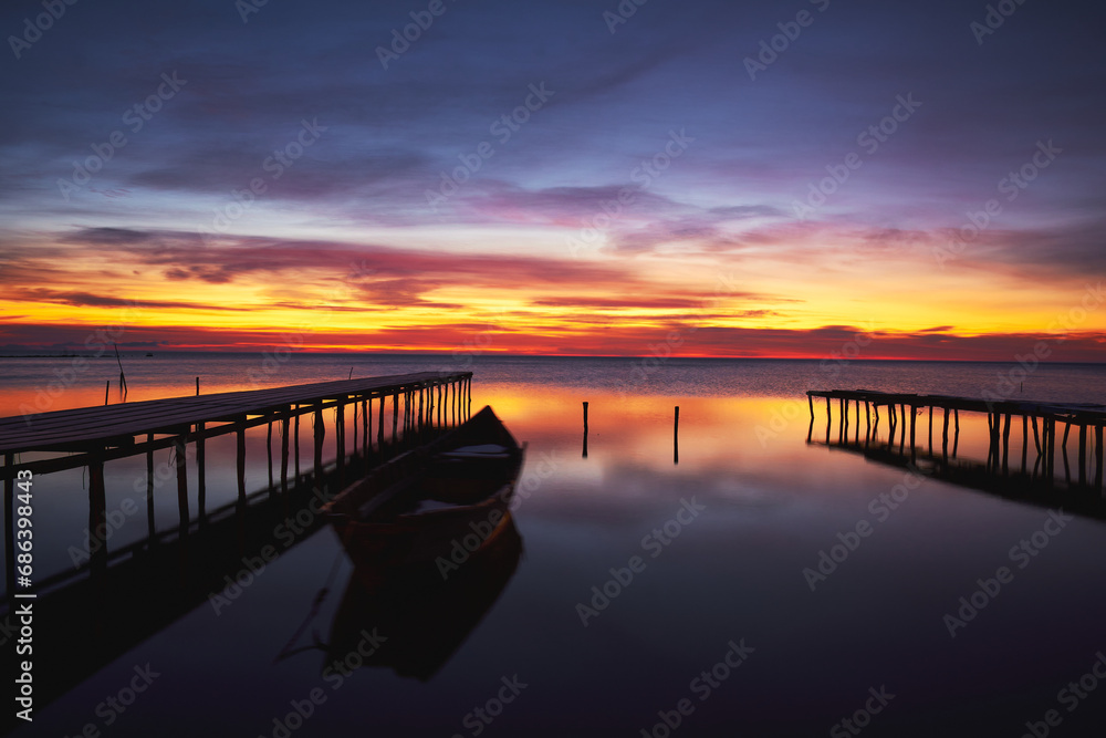 boat at sunrise on the lake